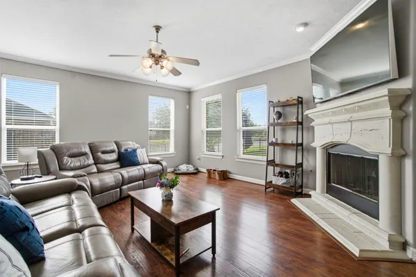 a living room with furniture fireplace and window