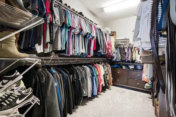 a bedroom with furniture and a window