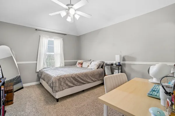 a bedroom with a bed and furniture