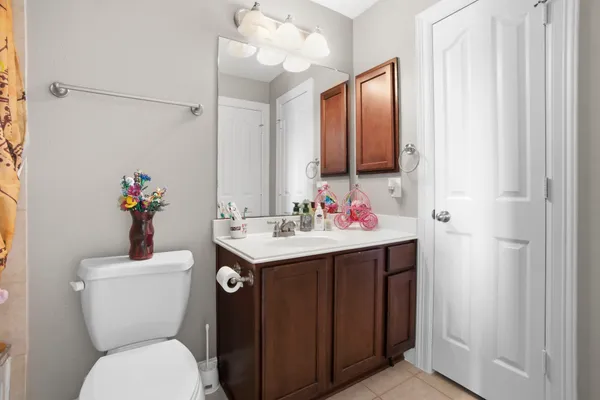 a view of swimming pool with outdoor seating and a potted plant