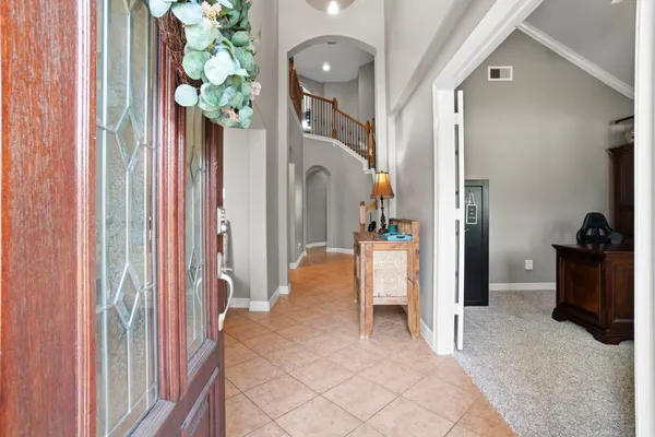a view of a livingroom with furniture and a chandelier