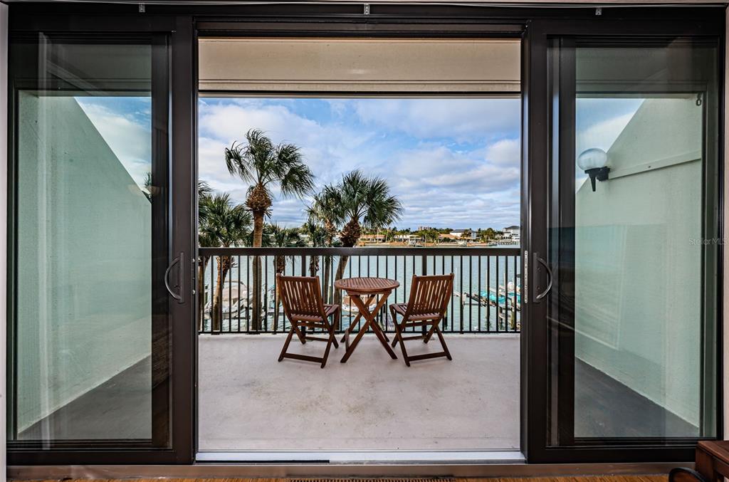 9495 Blind Pass Road, Unit 205 St. Pete Beach, FL 33706 - Photo 31 of 71 a view of a room with glass door