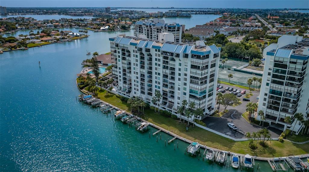 9495 Blind Pass Road, Unit 205 St. Pete Beach, FL 33706 - Photo 48 of 71 an aerial view of lake and residential houses with outdoor space