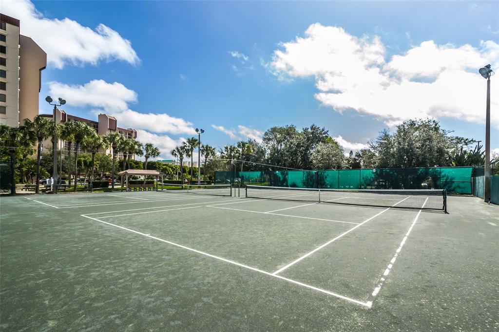9495 Blind Pass Road, Unit 205 St. Pete Beach, FL 33706 - Photo 61 of 71 a view of a tennis court