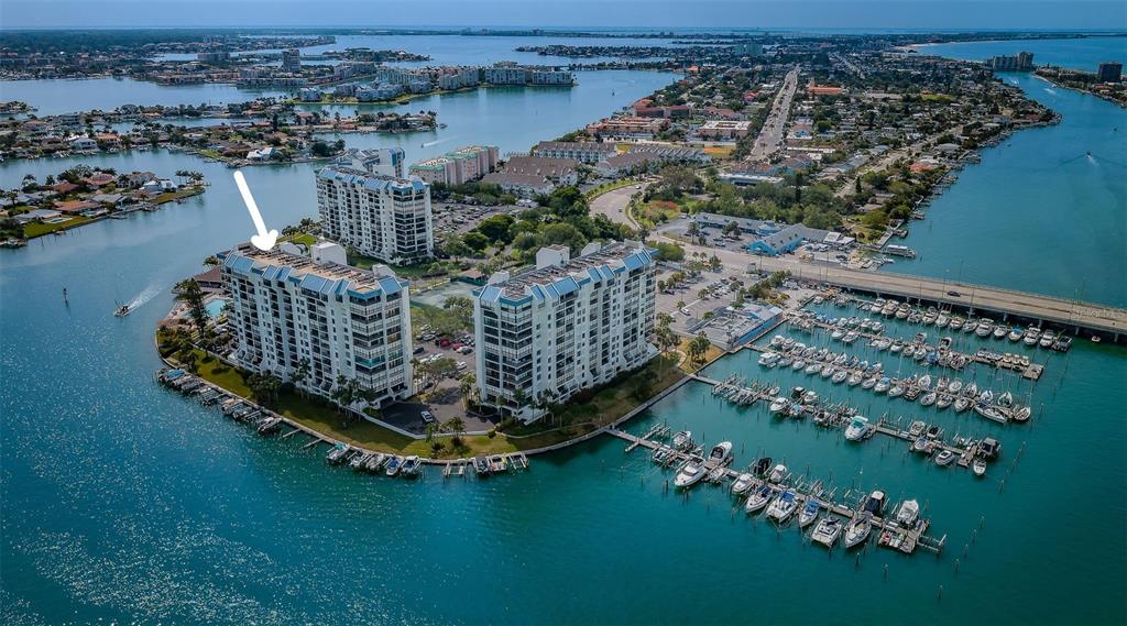 9495 Blind Pass Road, Unit 205 St. Pete Beach, FL 33706 - Photo 68 of 71 a view of a balcony with chairs