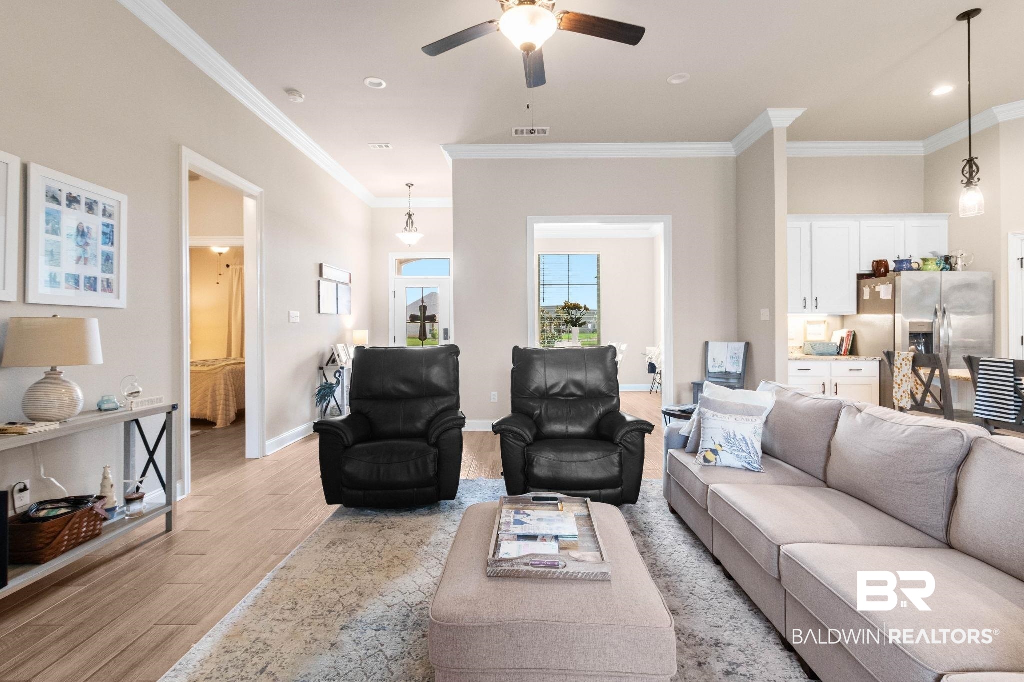 22244 Hibiscus Circle Foley, AL 36535 - Photo 15 of 51 Open concept living area featuring wood-finish flooring, recessed lighting, and crown molding