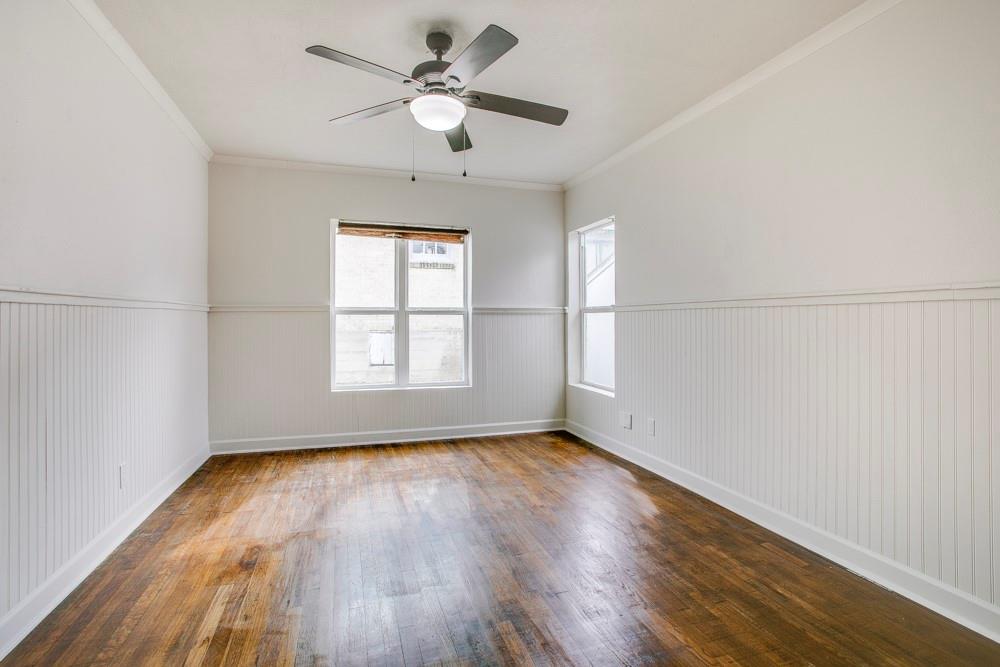 1331 Michigan Avenue Dallas, TX 75216 - Photo 24 of 40 wooden floor in an empty room with a window