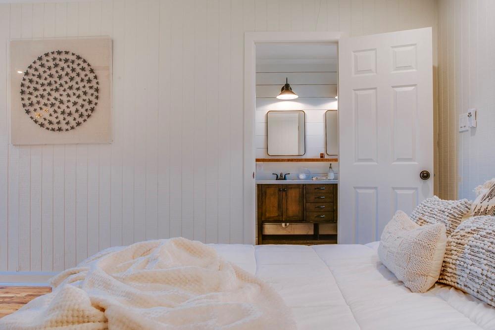 1331 Michigan Avenue Dallas, TX 75216 - Photo 29 of 40 a bedroom with a bed and a fireplace