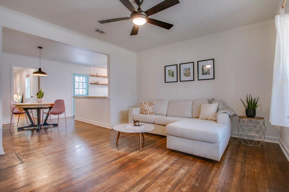 1331 Michigan Avenue Dallas, TX 75216 - Photo 5 of 40 a living room with furniture and a wooden floor