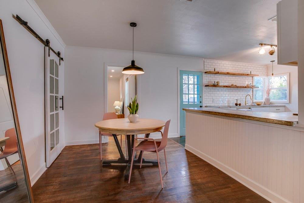 1331 Michigan Avenue Dallas, TX 75216 - Photo 8 of 40 a view of a dining room with furniture window and wooden floor