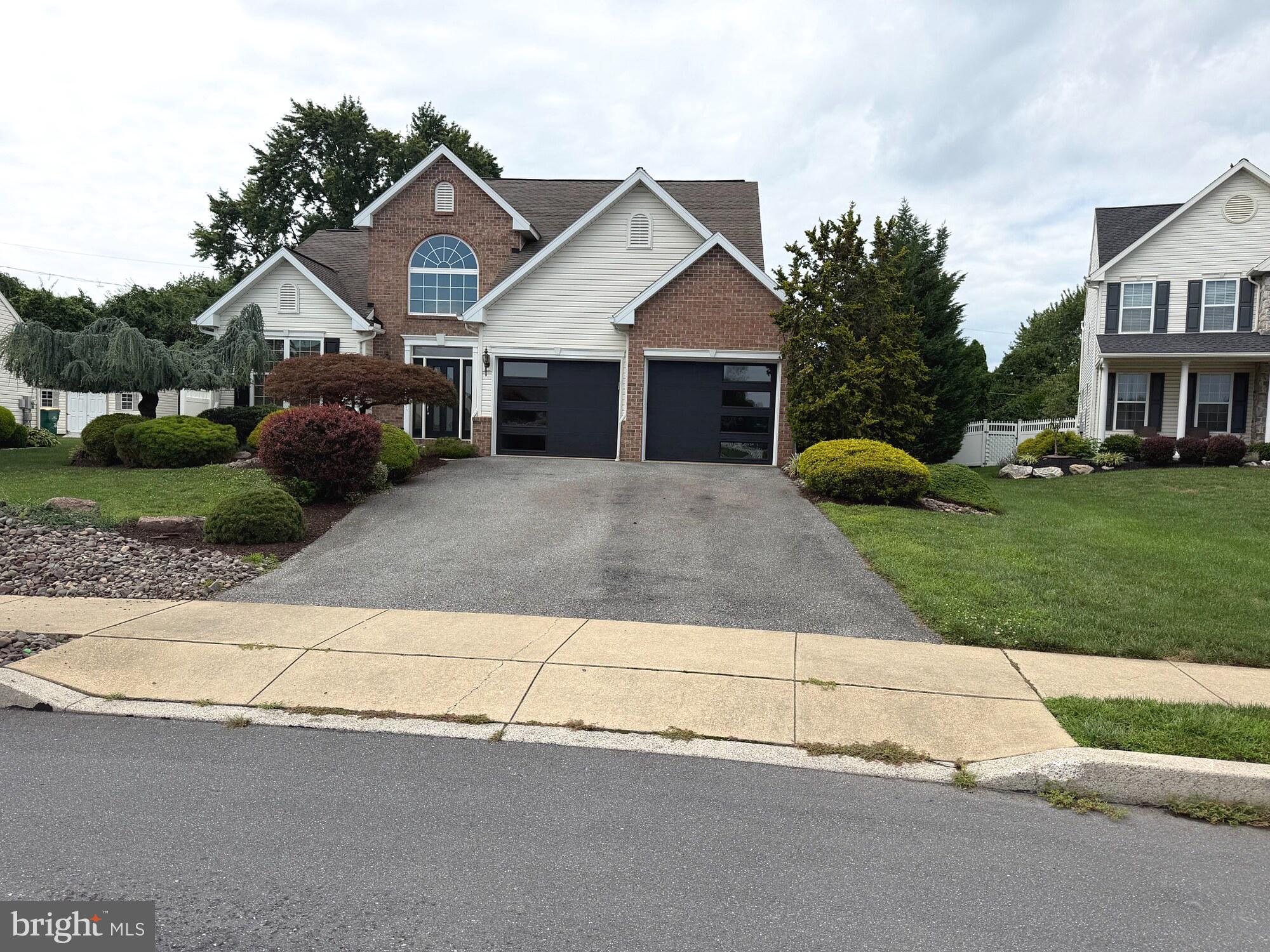 2543 Joshua Drive Sinking Spring, PA 19608 - Photo 1 of 7 Charming brick home with lush landscaping.