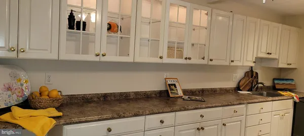 a kitchen with white cabinets