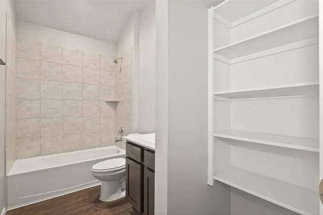 a bathroom with a toilet and a bathtub