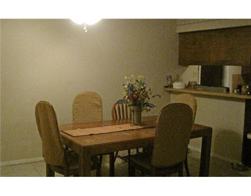 1618 Cheyenne Street Portland, TX 78374 - Photo 5 of 7 a kitchen with a table chairs and a sink