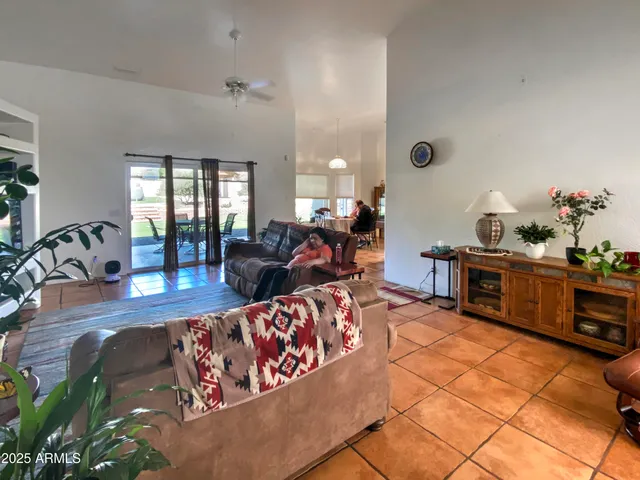 a bedroom with a large bed and a dresser