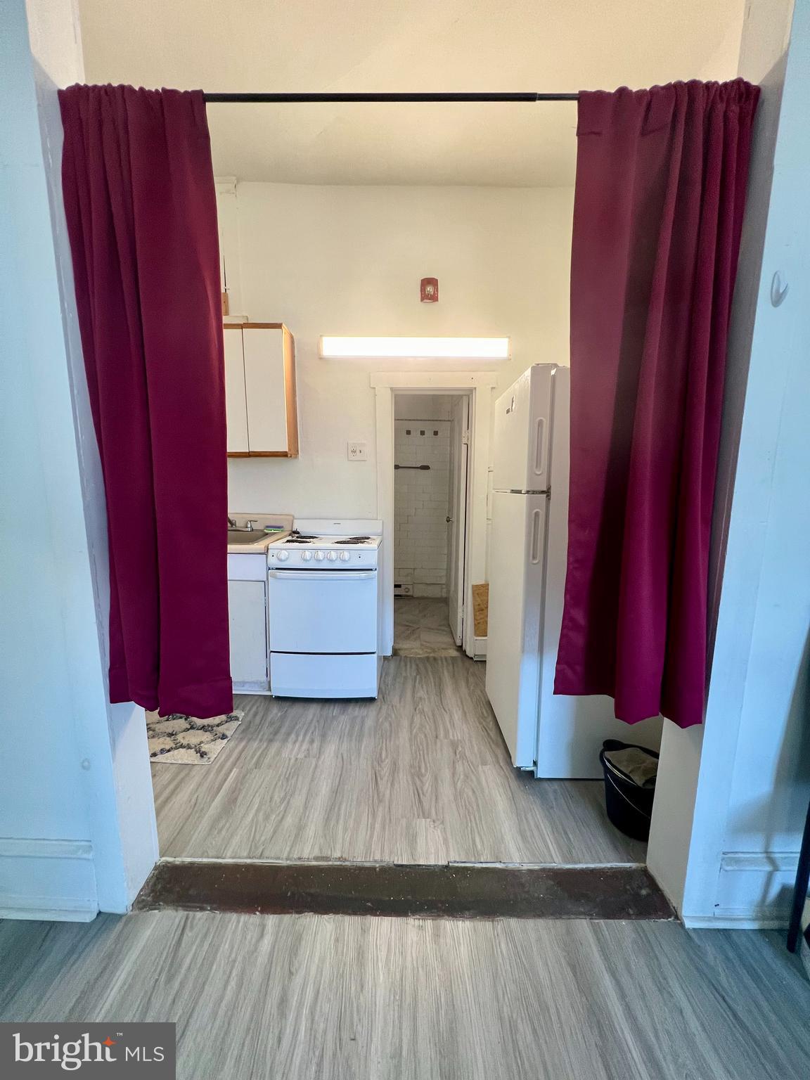 3140 North Broad Street, Unit 2F Philadelphia, PA 19132 - Photo 2 of 7 a view of a living room with wooden floor