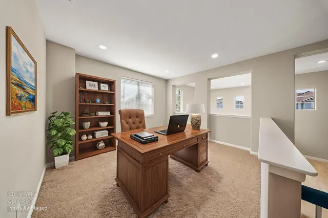 a view of a workspace with furniture and toys