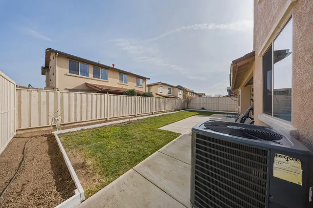 a spacious bathroom with a sink and a mirror