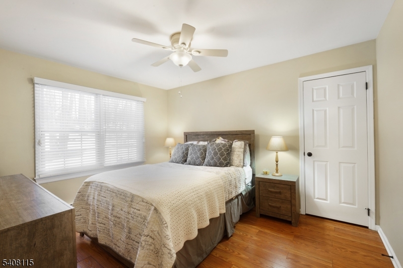 12 Waldon Road Califon, NJ 07830 - Photo 15 of 34 a bedroom with a bed and a chandelier
