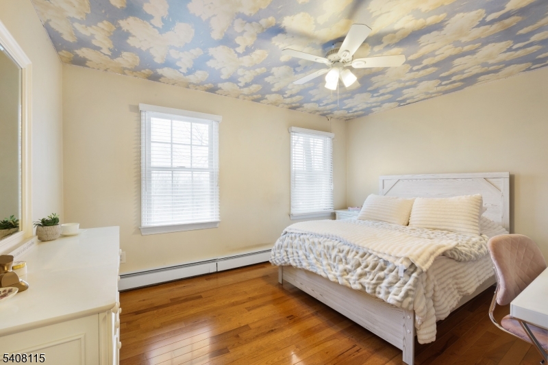 12 Waldon Road Califon, NJ 07830 - Photo 16 of 34 a bedroom with a bed and a chandelier