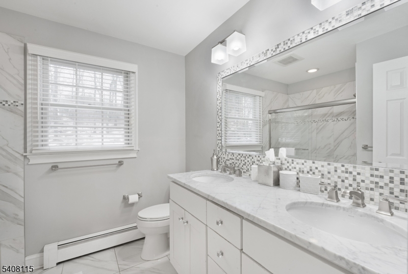 12 Waldon Road Califon, NJ 07830 - Photo 17 of 34 a bathroom with a granite countertop sink a toilet and a large mirror