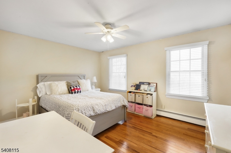 12 Waldon Road Califon, NJ 07830 - Photo 18 of 34 a bedroom with a large bed and a window