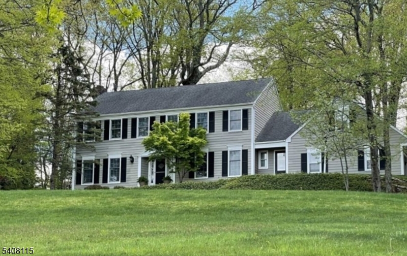 12 Waldon Road Califon, NJ 07830 - Photo 2 of 34 a front view of a house with a garden