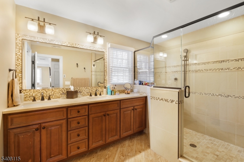 12 Waldon Road Califon, NJ 07830 - Photo 21 of 34 a bathroom with a double vanity sink mirror and shower