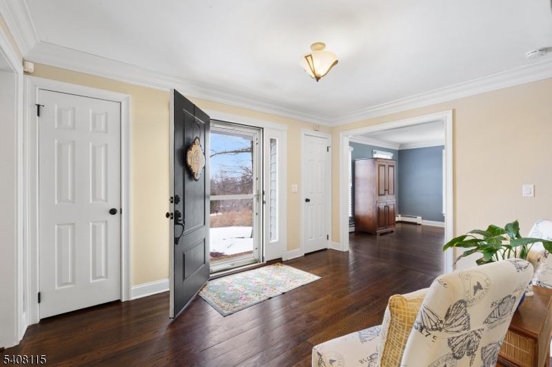 12 Waldon Road Califon, NJ 07830 - Photo 4 of 34 a hallway with wooden floor and glass door