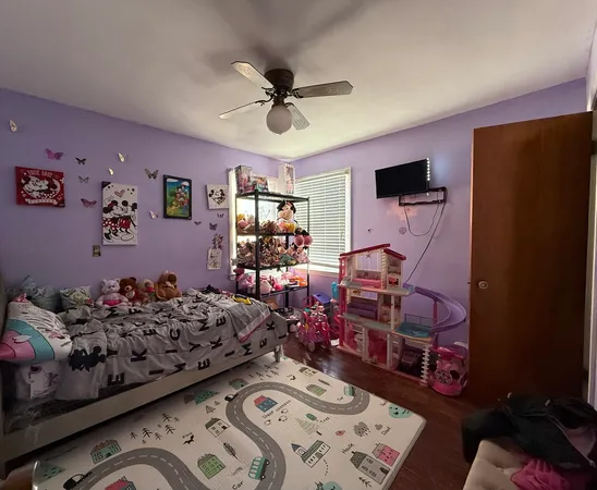 a bedroom with bed and a window