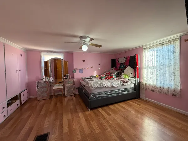 a bed room with a bed and a window