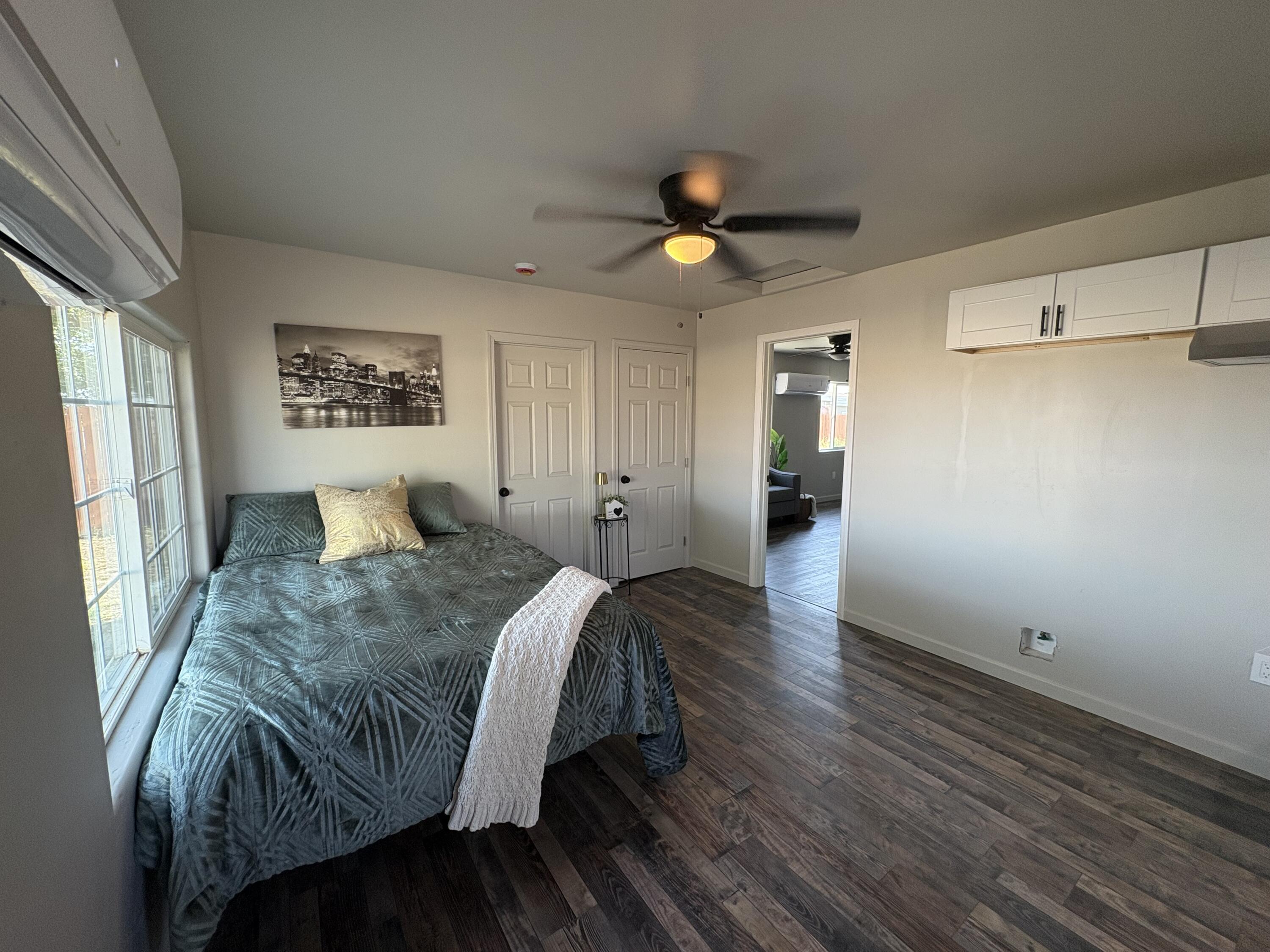 177 South Callison Road Tipton, CA 93272 - Photo 12 of 18 a spacious bedroom with a bed and cabinets