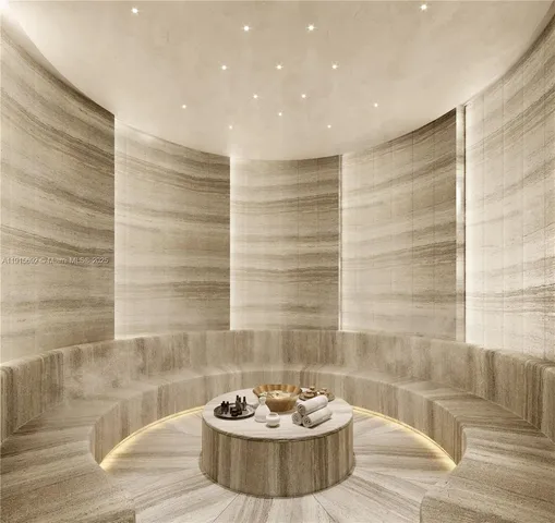 a room with furniture and large windows