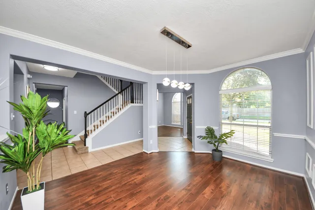 a view of entryway with wooden floor