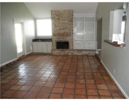 a view of empty room with windows