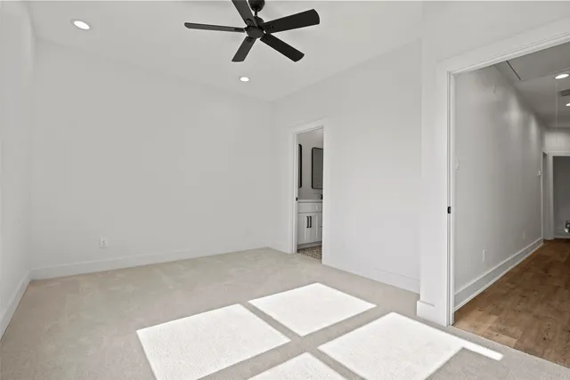 a view of a backyard with wooden fence