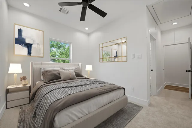 a bathroom with double vanity sinks a toilet and a bathtub