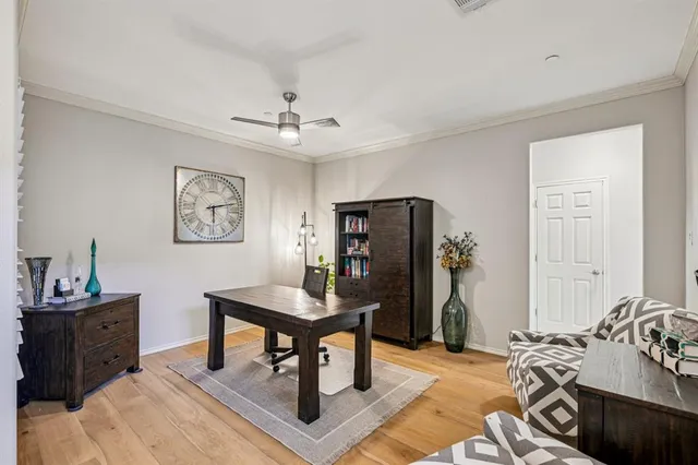 a bathroom with a tub a sink double vanity and a mirror