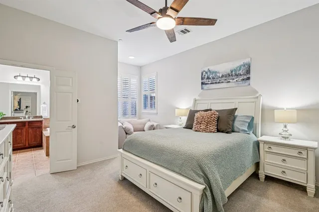 a bedroom with a bed and a view of bathroom