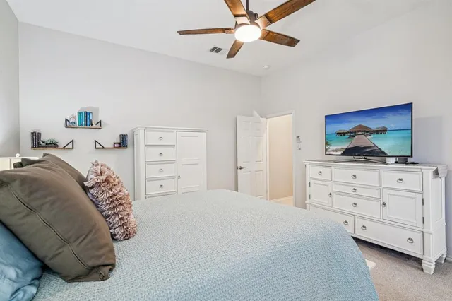 a spacious bathroom with a granite countertop sink and a mirror