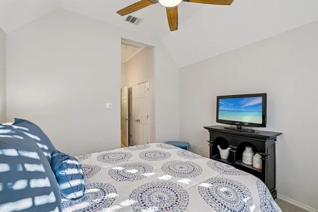 a view of a house with wooden fence