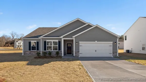 a front view of a house with yard