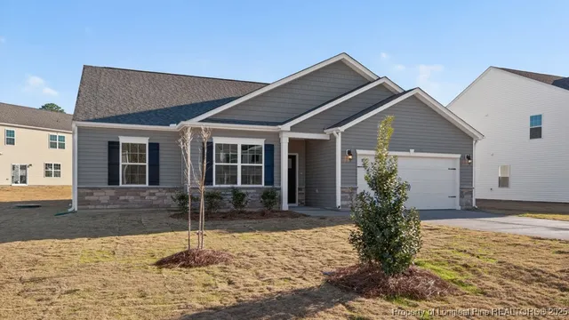 a front view of a house with garden