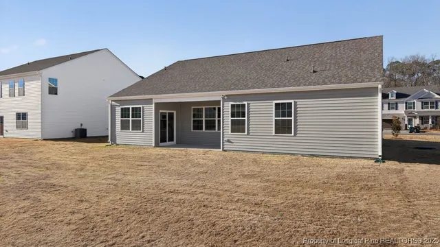 a view of house with yard and ocean view