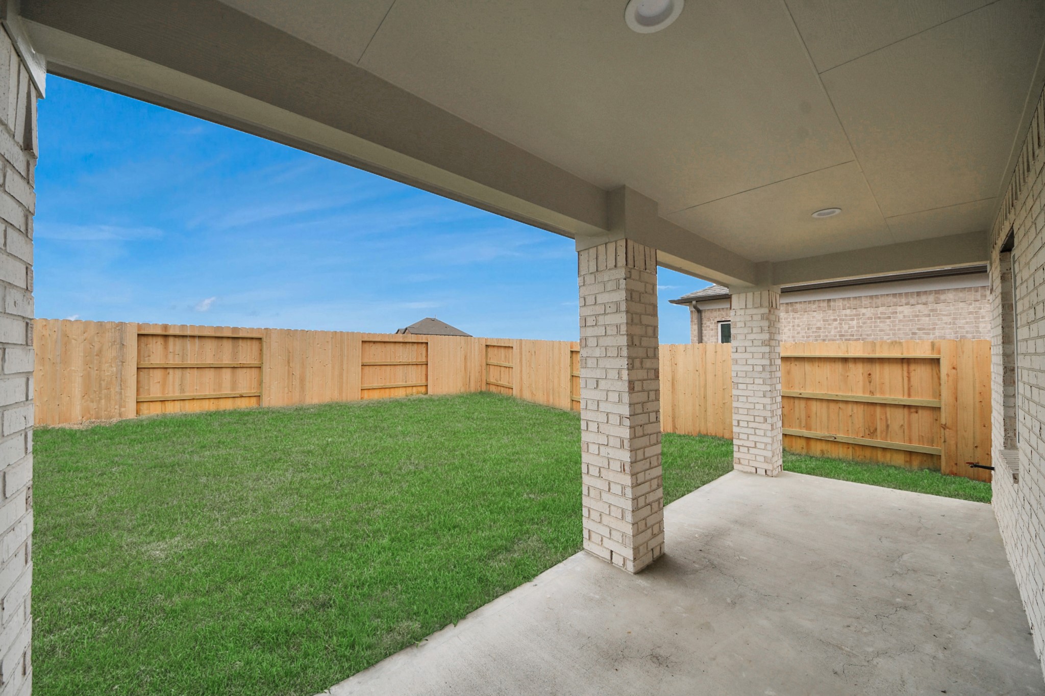 24518 Broad Park Spring, TX 77373 - Photo 29 of 29 Experience outdoor living at its finest on this expansive covered patio, thoughtfully designed for BBQs and delightful outdoor dining. Sample photo of completed home with similar floor plan. Actual colors and selections may vary.