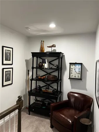 a living room with furniture a flat screen tv and a window