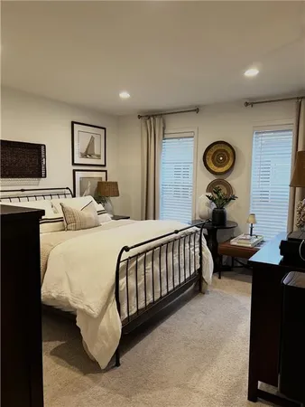 a bedroom with a bed and a tv