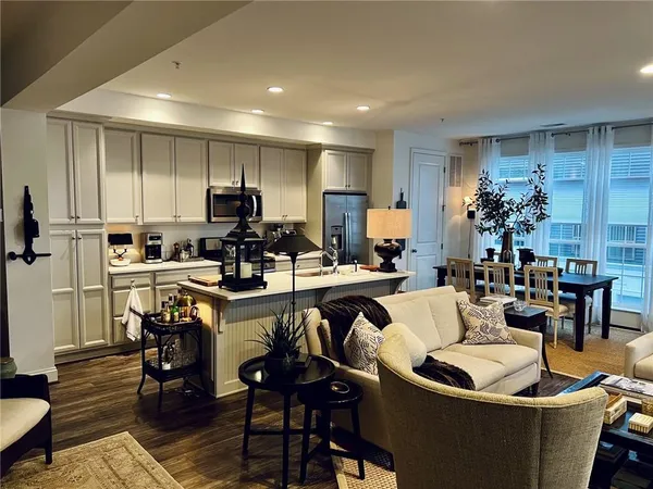a large kitchen with a table and chairs