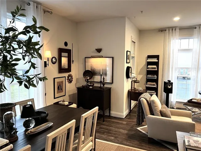a living room with furniture fireplace and flat screen tv