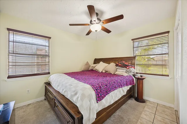 a bedroom with a bed and window